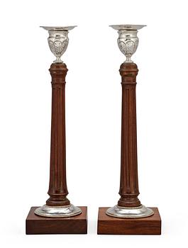 674. A pair of Swedish silver and mahogany candlesticks by Peter Ohlijn, Karlskrona 1800.
