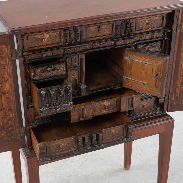 A 19th Century mahognay cabinet with older parts.