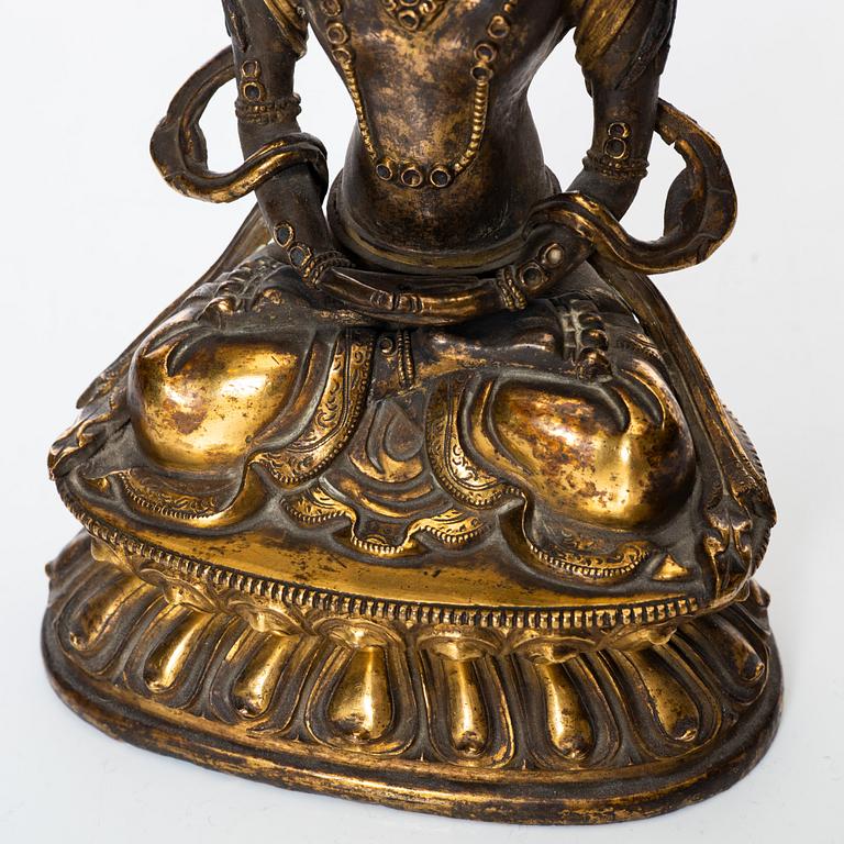 A gilt copper figure of Amitayus, Tibeto-Chinese, 18th Century.