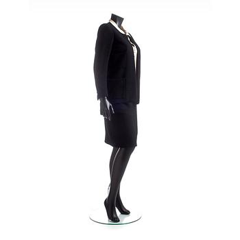 CHANEL, a two-piece suit consisting of jacket and skirt.