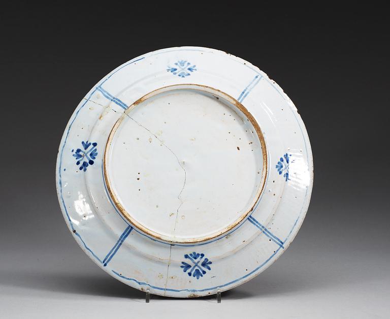 An armorial faiance charger, 18th Century, presumably Dutch.