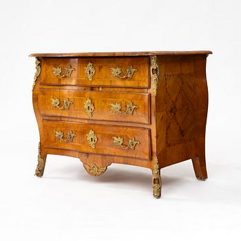 A Swedish elm-parquetry rococo commode, later part 18th century.