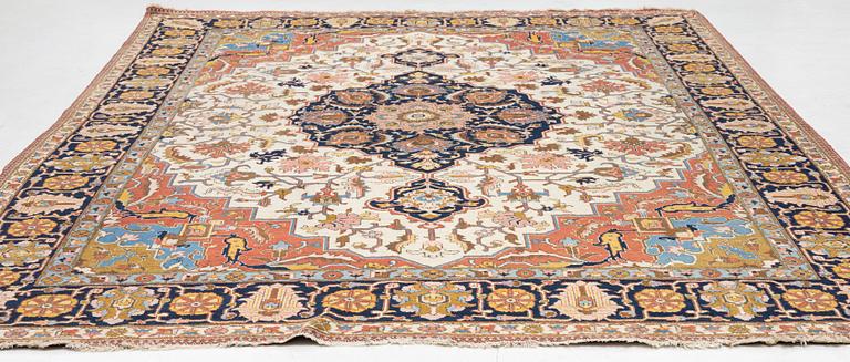 An antique Tabriz carpet, c. 365 x 280 cm.