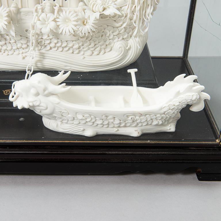 An oriental Boat sculpture in porcelain.