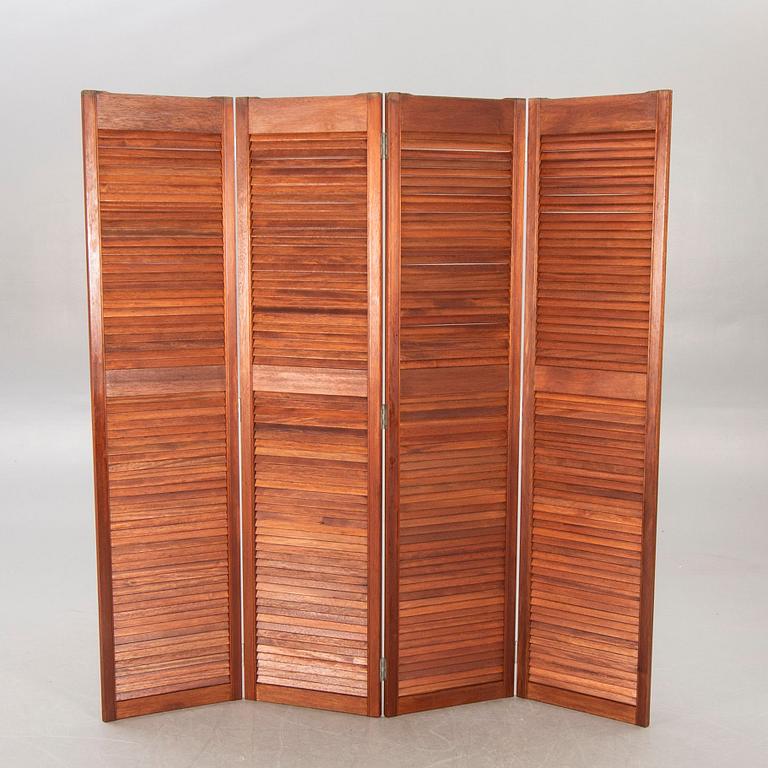 A 21st century stained wood folding screen.