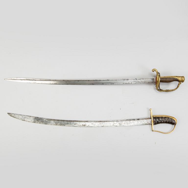 An end of the 18th Century Swedish sabre and a 19th century French century sabre, both with scabbards.