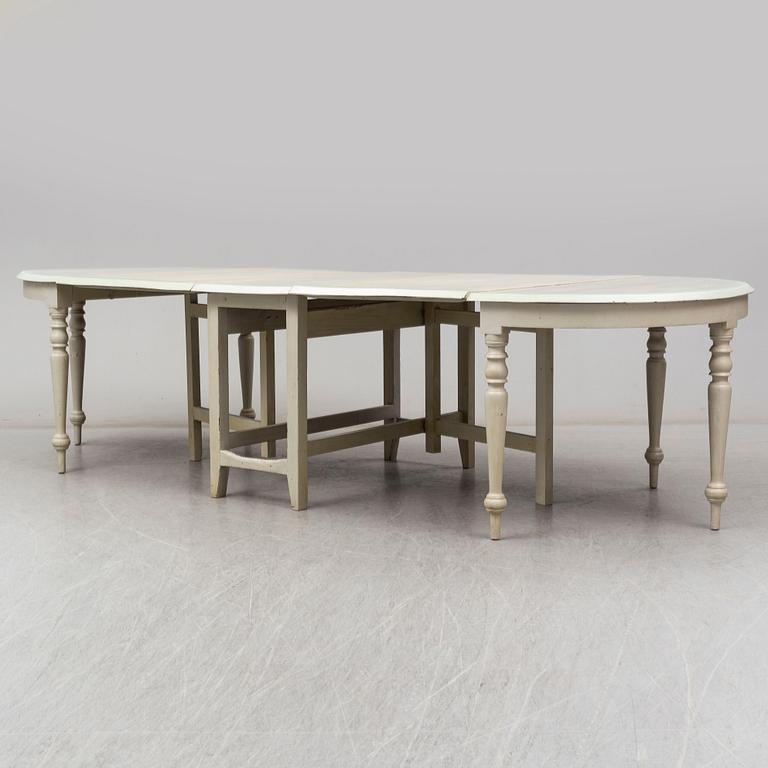 A 19th century dining table in three parts.