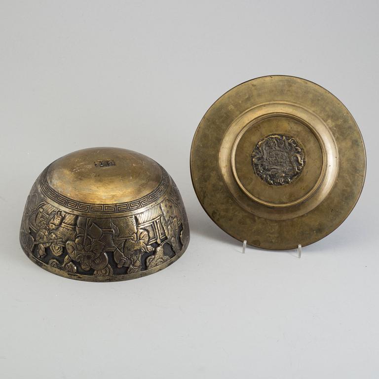 A Chinese brass bowl and Japanese dish, 20th century.