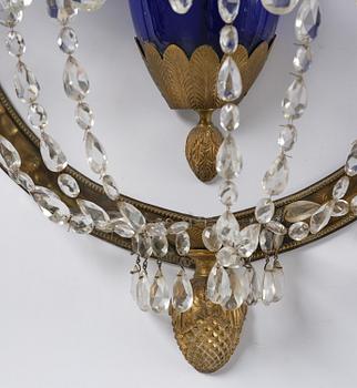 A pair of Russian Louis XVI-style  four-branch gilt bronze appliques, 19th century.