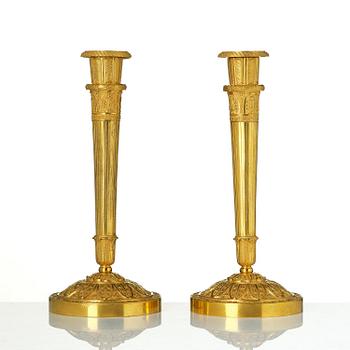 A pair of Empire ormolu candlesticks.