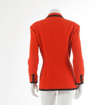 CHANEL, a orange wool jacket. French size 42.