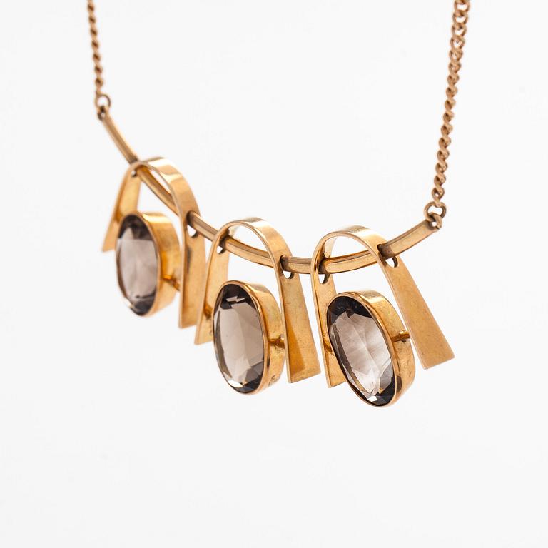Eero Rislakki, halssmycke, fasettslipade rökkvartser, 14K guld. Westerback, 1960.