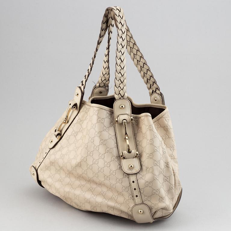 Gucci, leather bag.