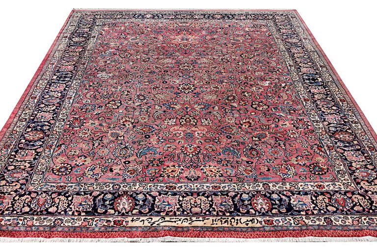 An antique Saber carpet, signed, a. 405 x 295 cm.