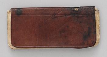 R.M.S. TITANIC THIRD CLASS PASSENGER MALKOLM JOHNSON COLLECTION: NOTEBOOK. Leather and paper 13,5x6 cm. Provenance: Malkolm Johnson. Thence by descent. This notebook is listed on the offical list from the Swedish ministry for foreign affairs.