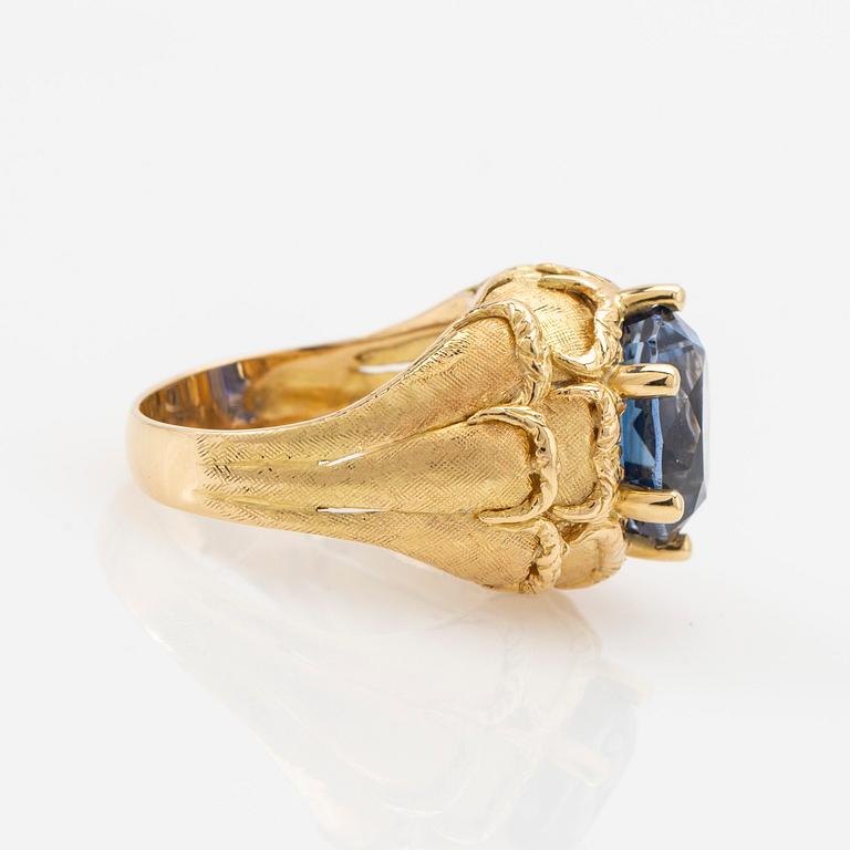 Ring, 18k gold with blue stone, possibly sapphire.