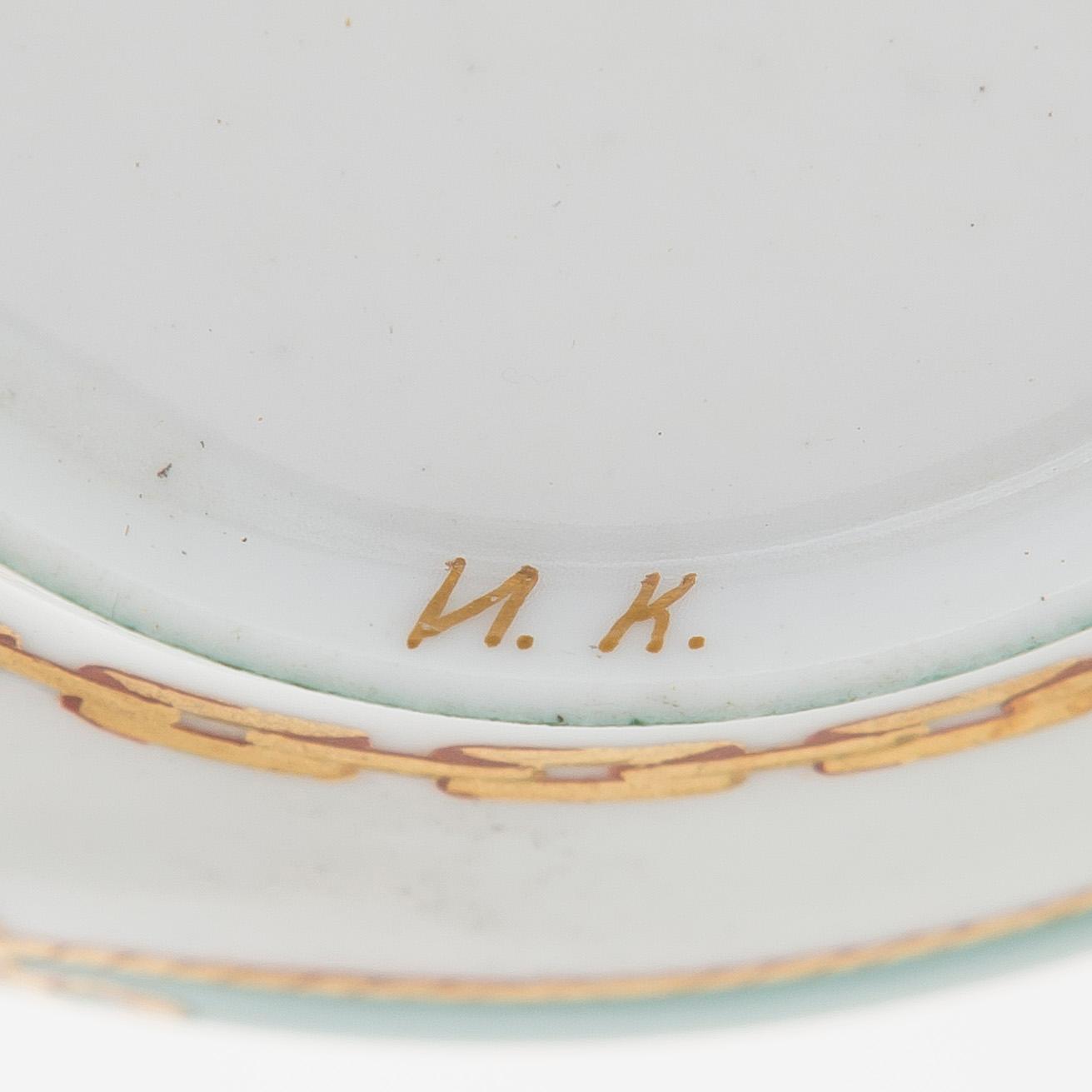 A cup and saucer from the Derzhava service, Imperial Porcelain Manufactory, St. Petersburg, late 19th century.