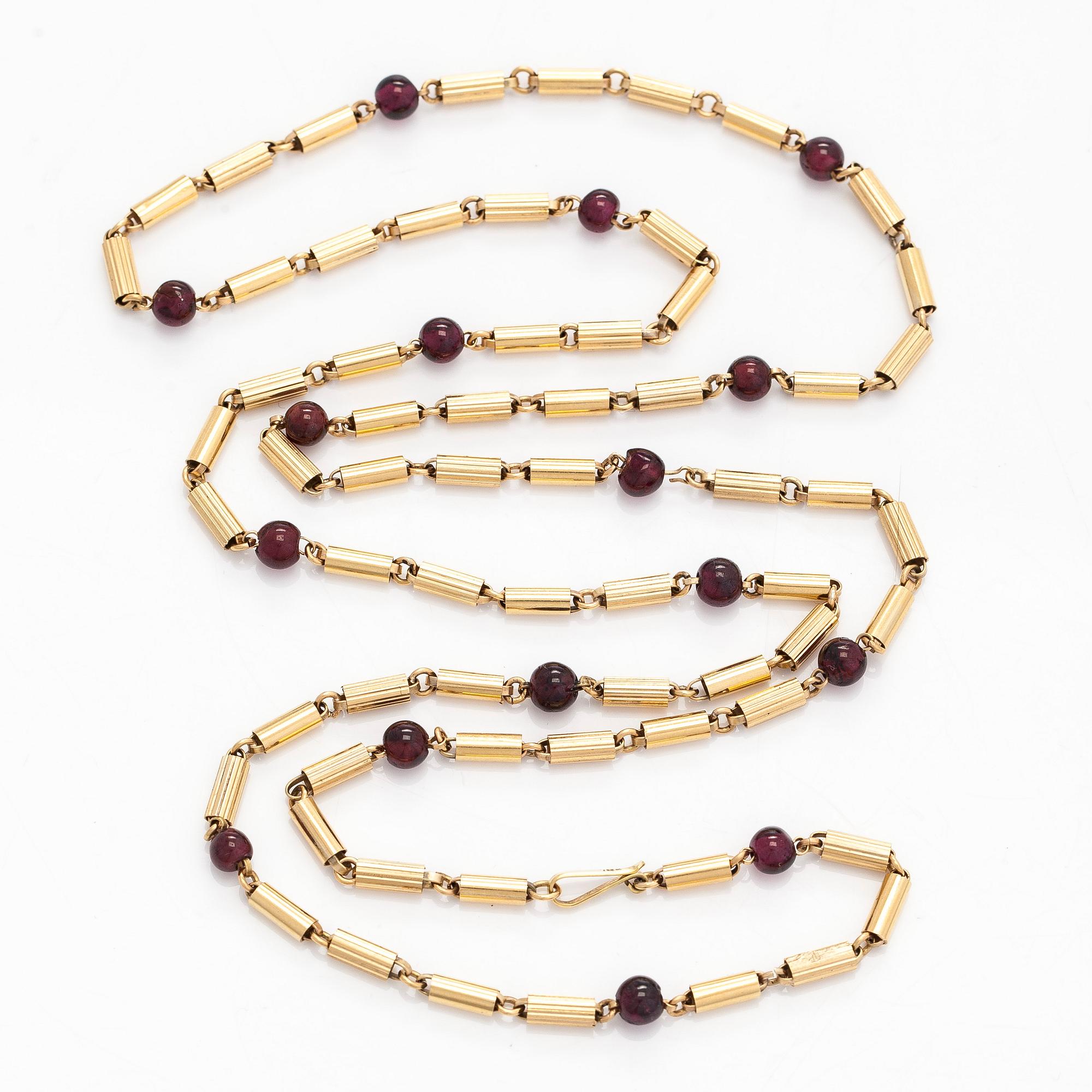 A 16K gold necklace with garnets.