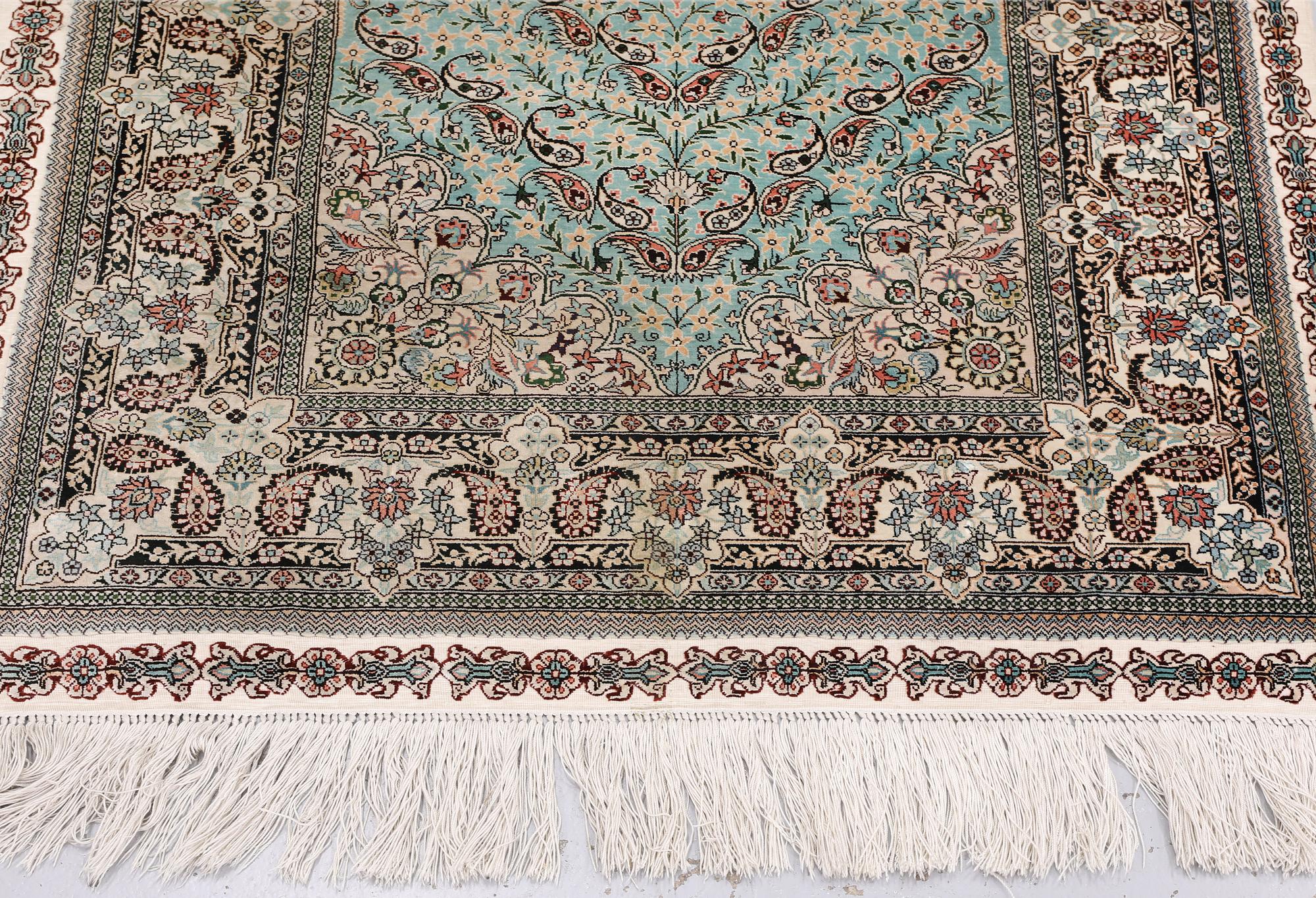 An Oriental silk rug, approx. 154 x 91 cm.