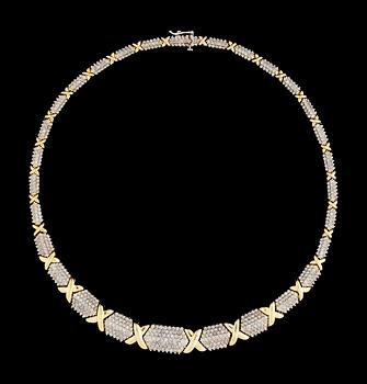 664. A gold and diamond collar.