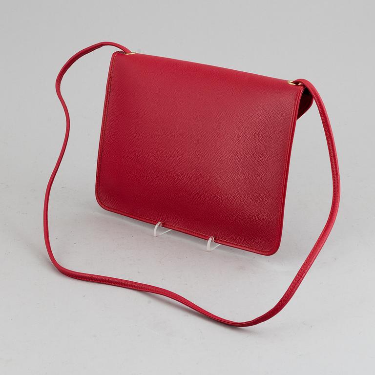 YVES SAINT LAURENT, a red leather bag.