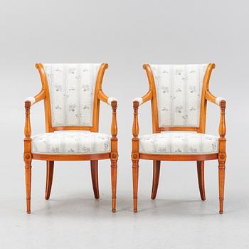 A pair of Louis XVI-style open armchairs, 20th century.