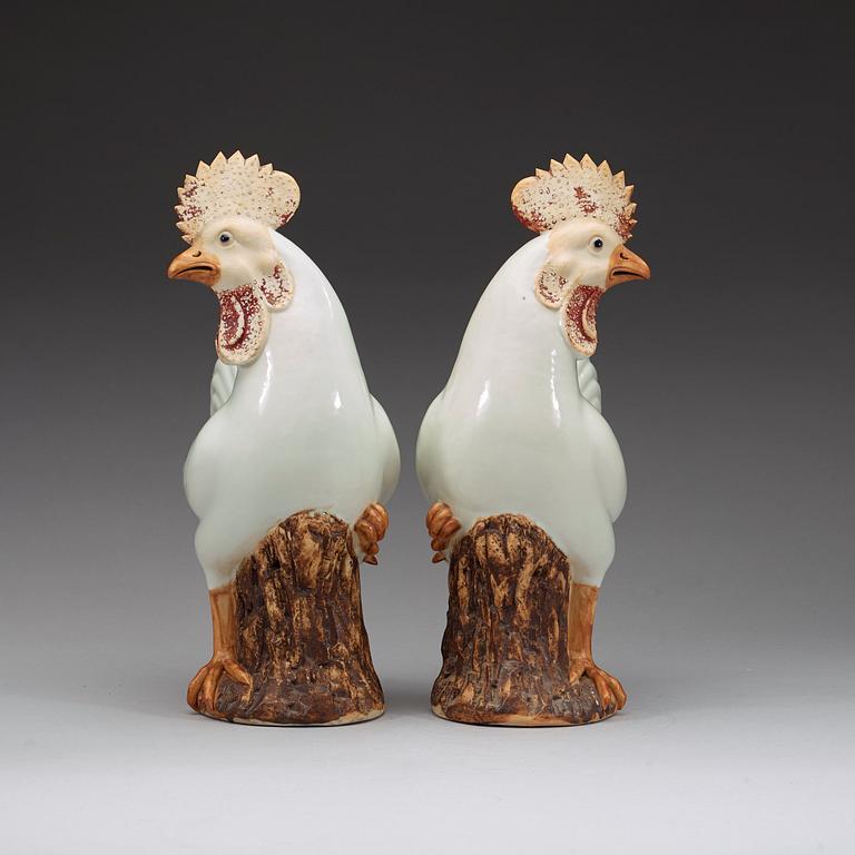 A pair of large white and brown glazed roosters, late Qing dynasty.