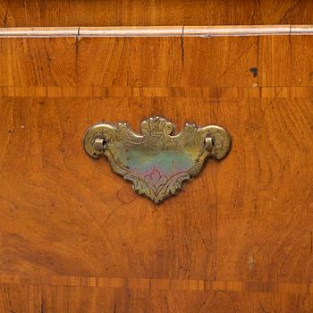 A late Baroque walnut-veneered cabinet in the manner of J. H. Fürloh, mid 18th century.