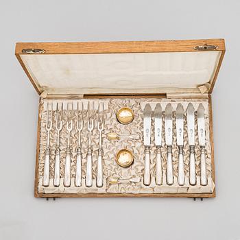 A 12-piece set of silver cutlery, a pair of salt cellars and salt spoons, Russia, around the turn of the 20th century.