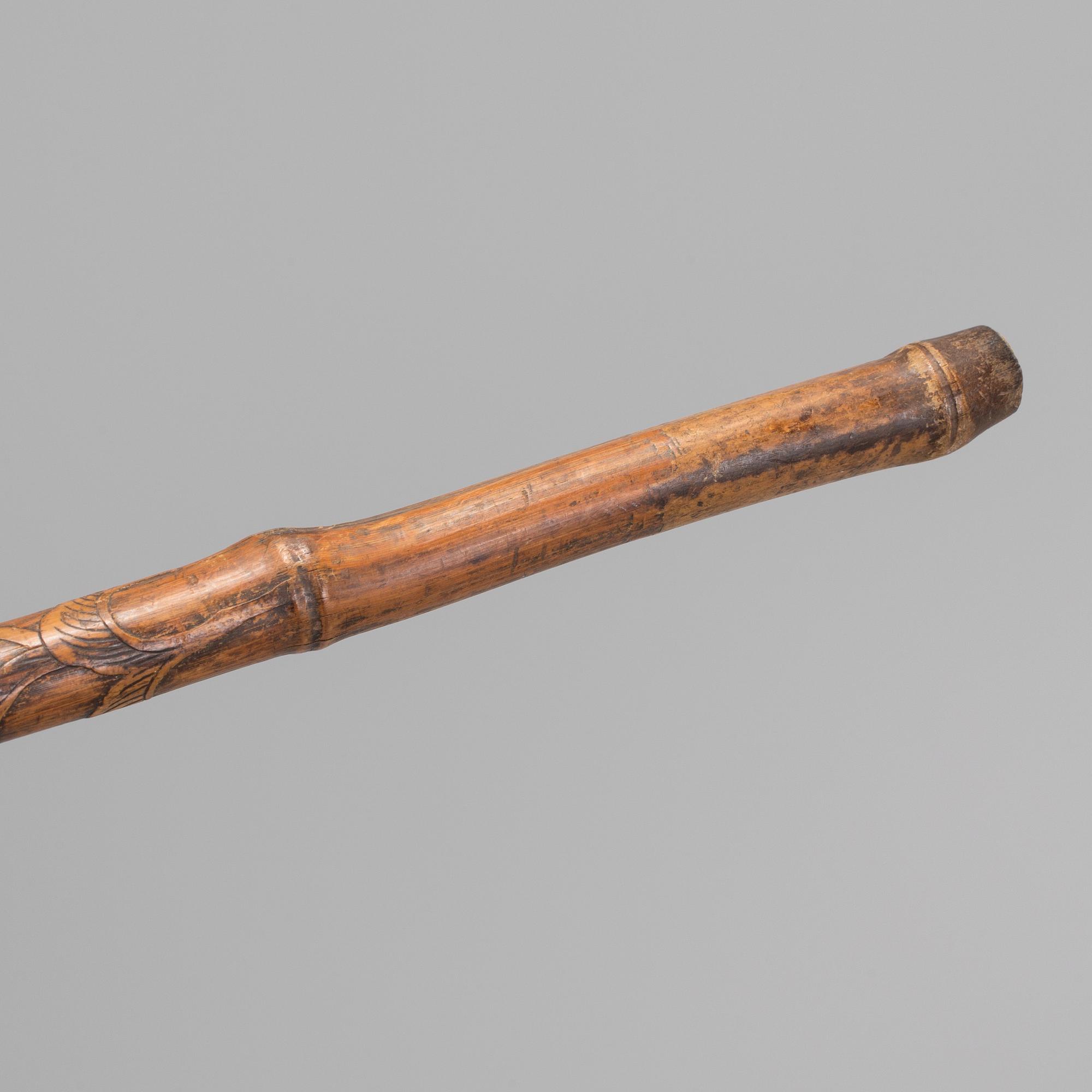 A CHINESE BAMBOO WALKING STICK, latter part of the 19th century.