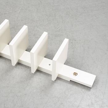 A 'Pilaster' shelf by John Kandell for Källemo, designed 1988.