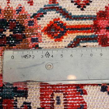 A Hosseinabad rug, 281 x 106 cm.