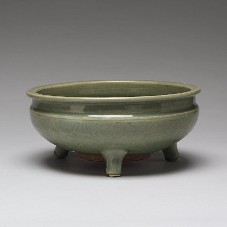 A celdonglazed tripod censer, Ming dynasty (1368-1644).