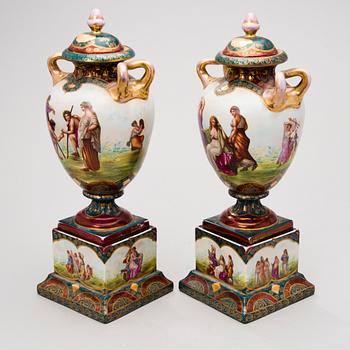 Two similar porcelain urns from around year 1900.