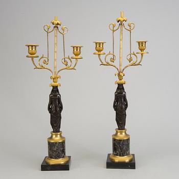 A pair of 1800s empire candelabras.