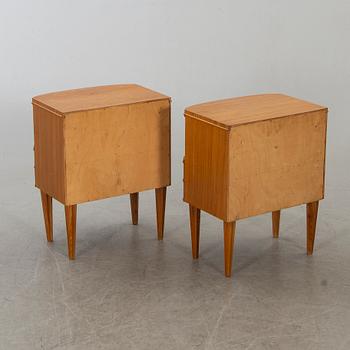 A pair of bedside tables from the mid 20th century.
