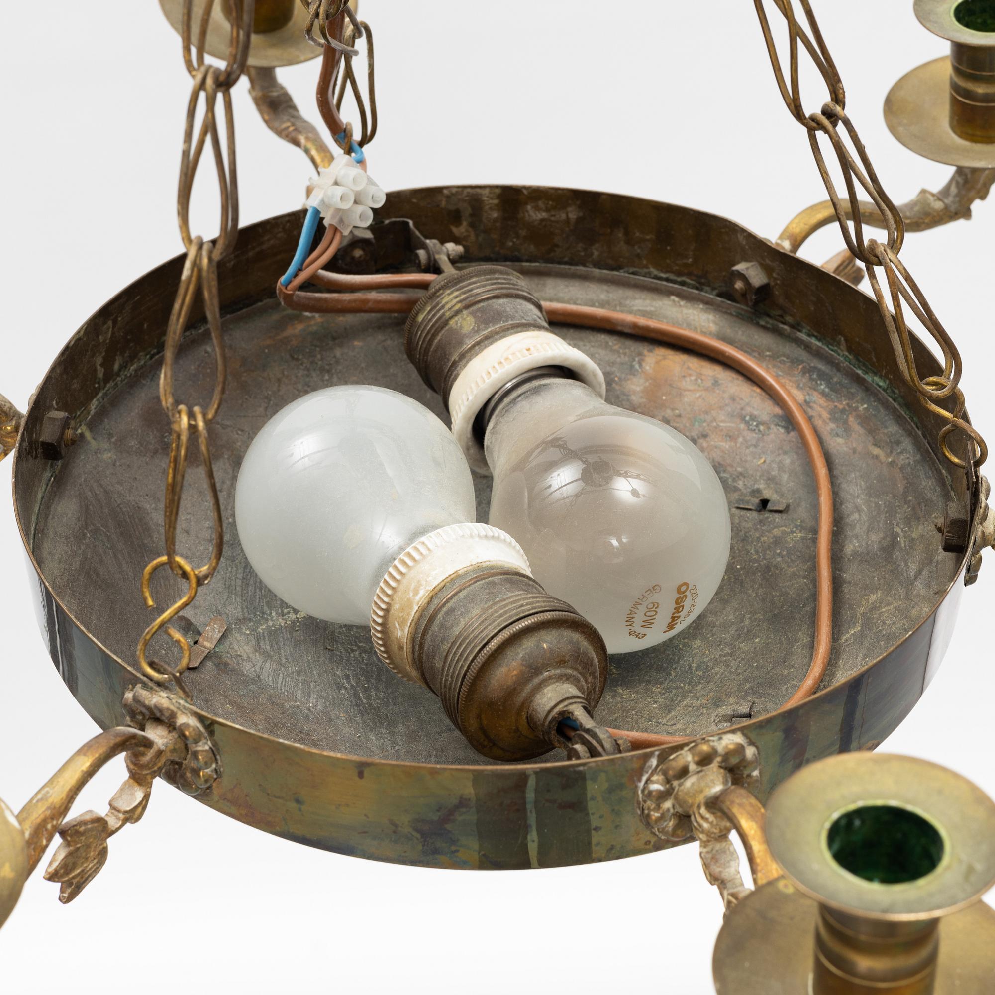 An empire style brass chandelier, around 1900.