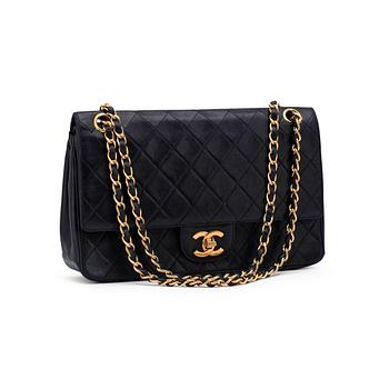 618. CHANEL, a blue leather "Flap Bag".