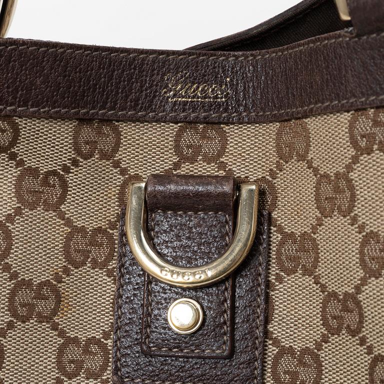 Gucci, a canvas and leather bag.