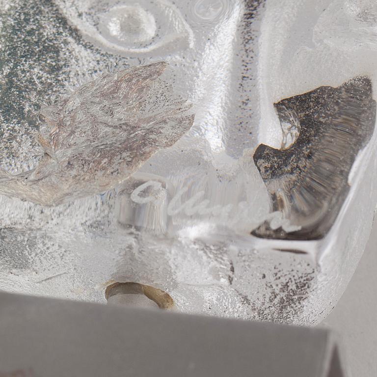 a glass object, signed.