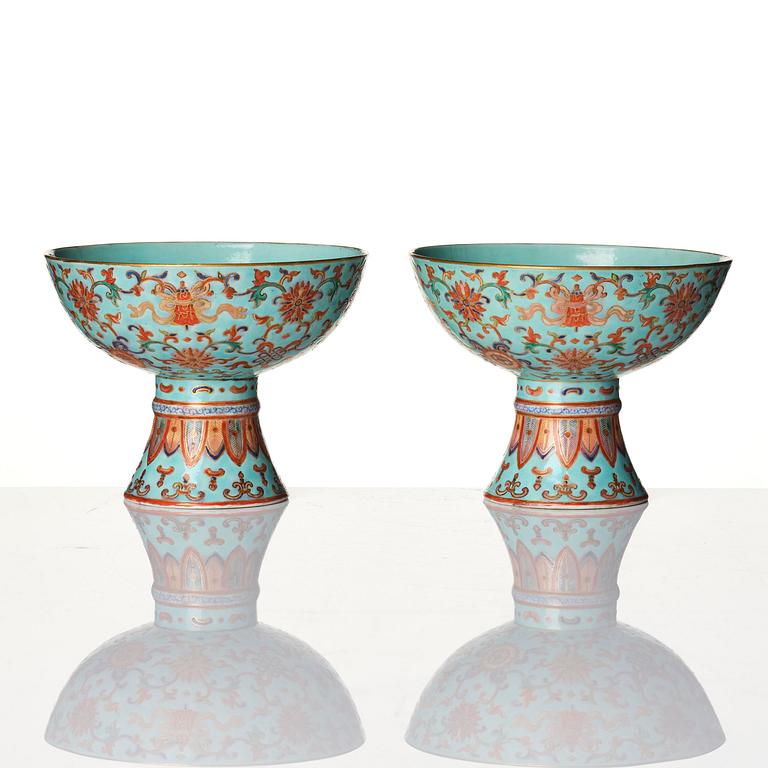 A pair of rare turquoise ground 'baijiaxiang' stemcups, Qing dynasty with Daoguang mark and period (1821-1850).