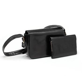 CÉLINE, a black leather shoulder bag and wallet.