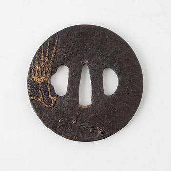 A round iron tsuba decorated with a dragon, Japan, Edo-period,