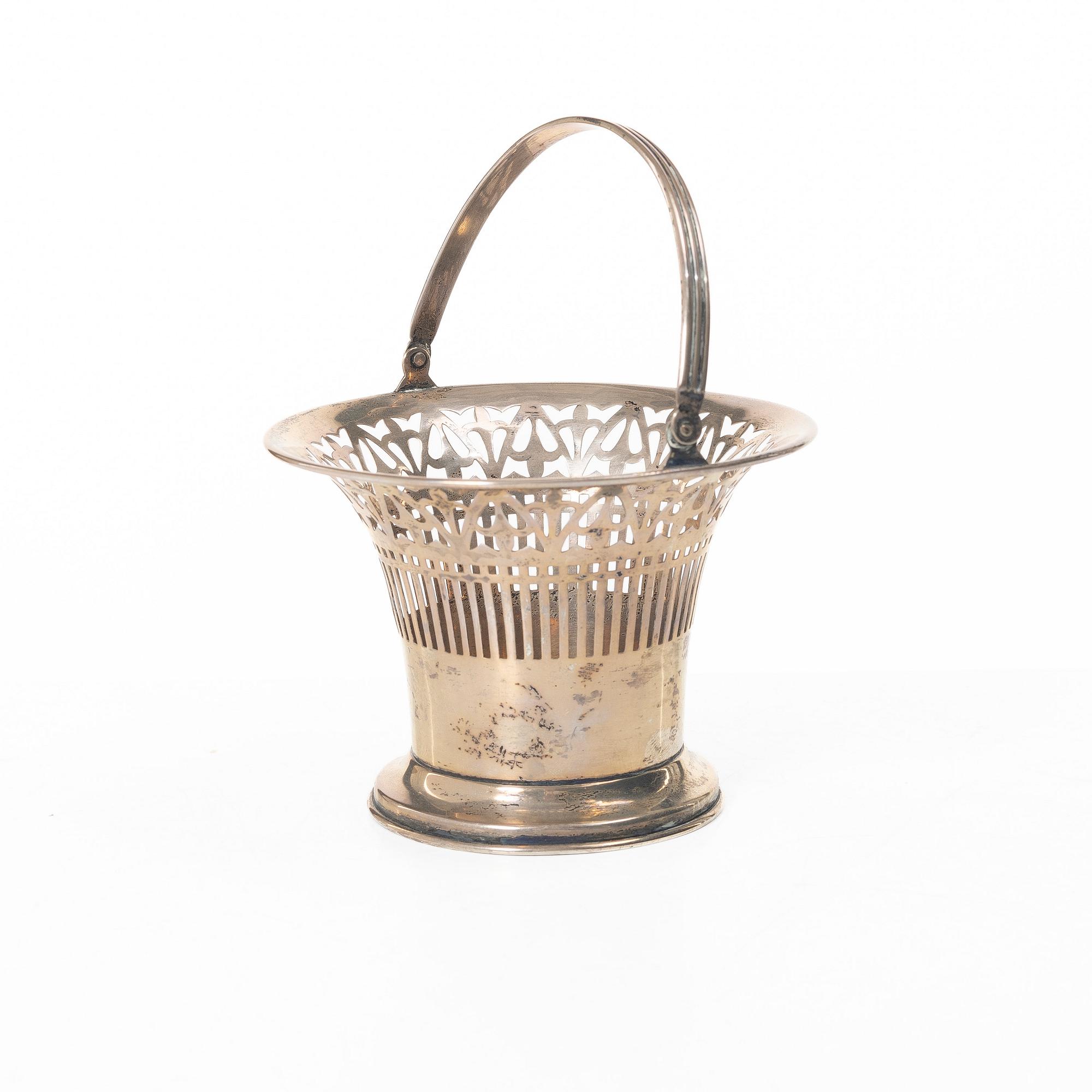 A sterling silver bowl with handle, signed with monogram CMM, 20th century.