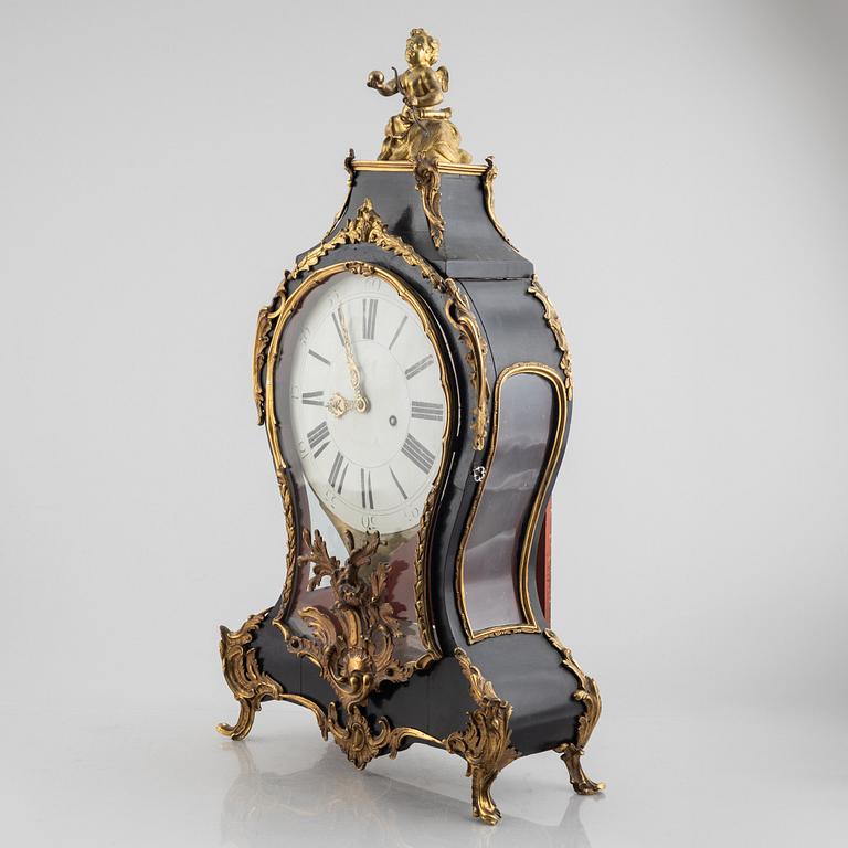 Clock, Rococo style with partially older parts, around the year 1900.