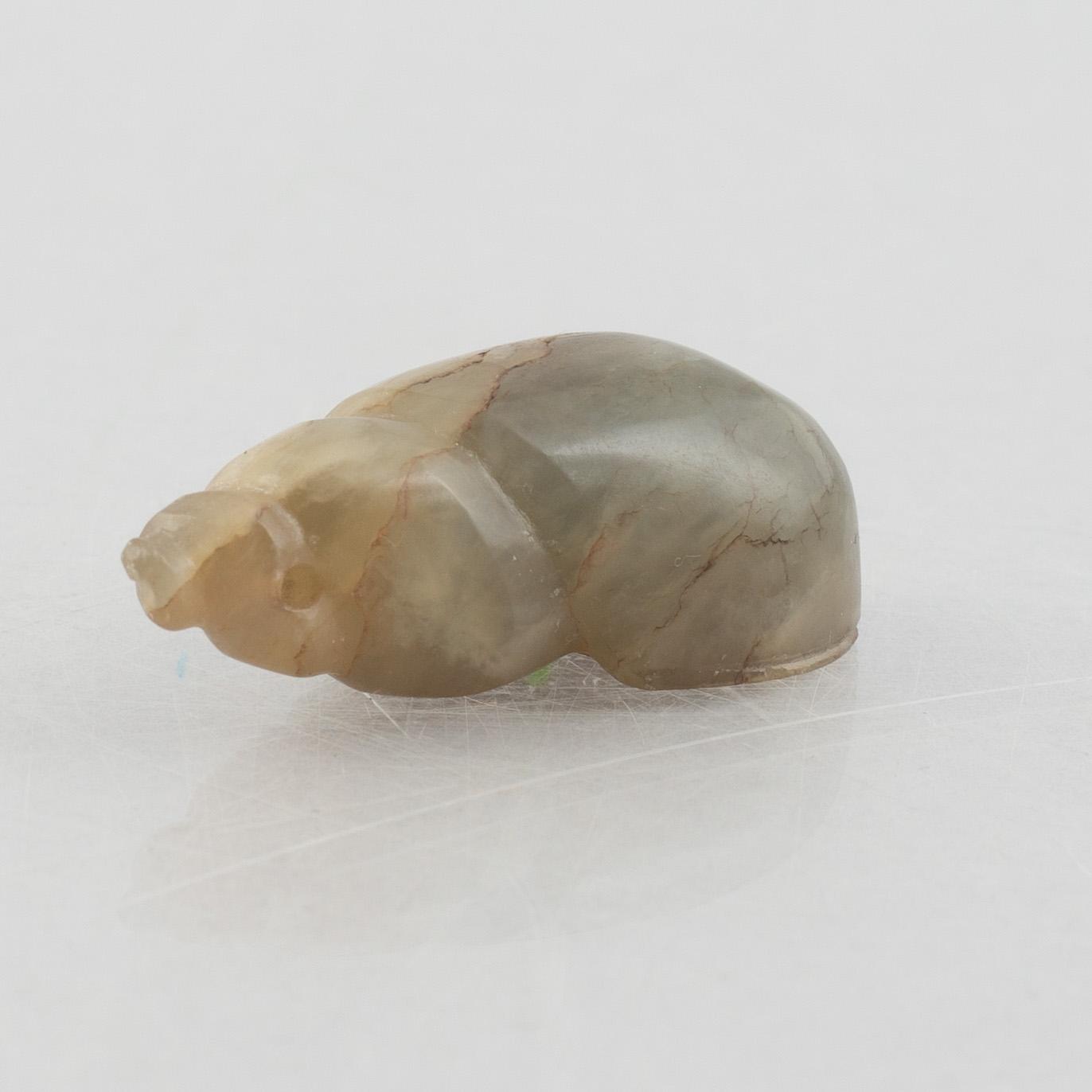 A group of three Chinese stone charms, 20th century.