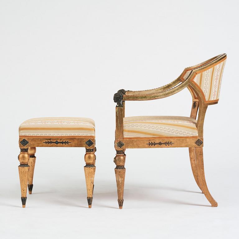 A Late gustavian armchair and stool in the manner of C G Gjörwll (1766-1837).