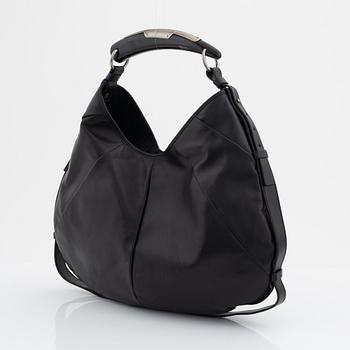 Yves Saint Laurent, a black leather and horn hobo bag.
