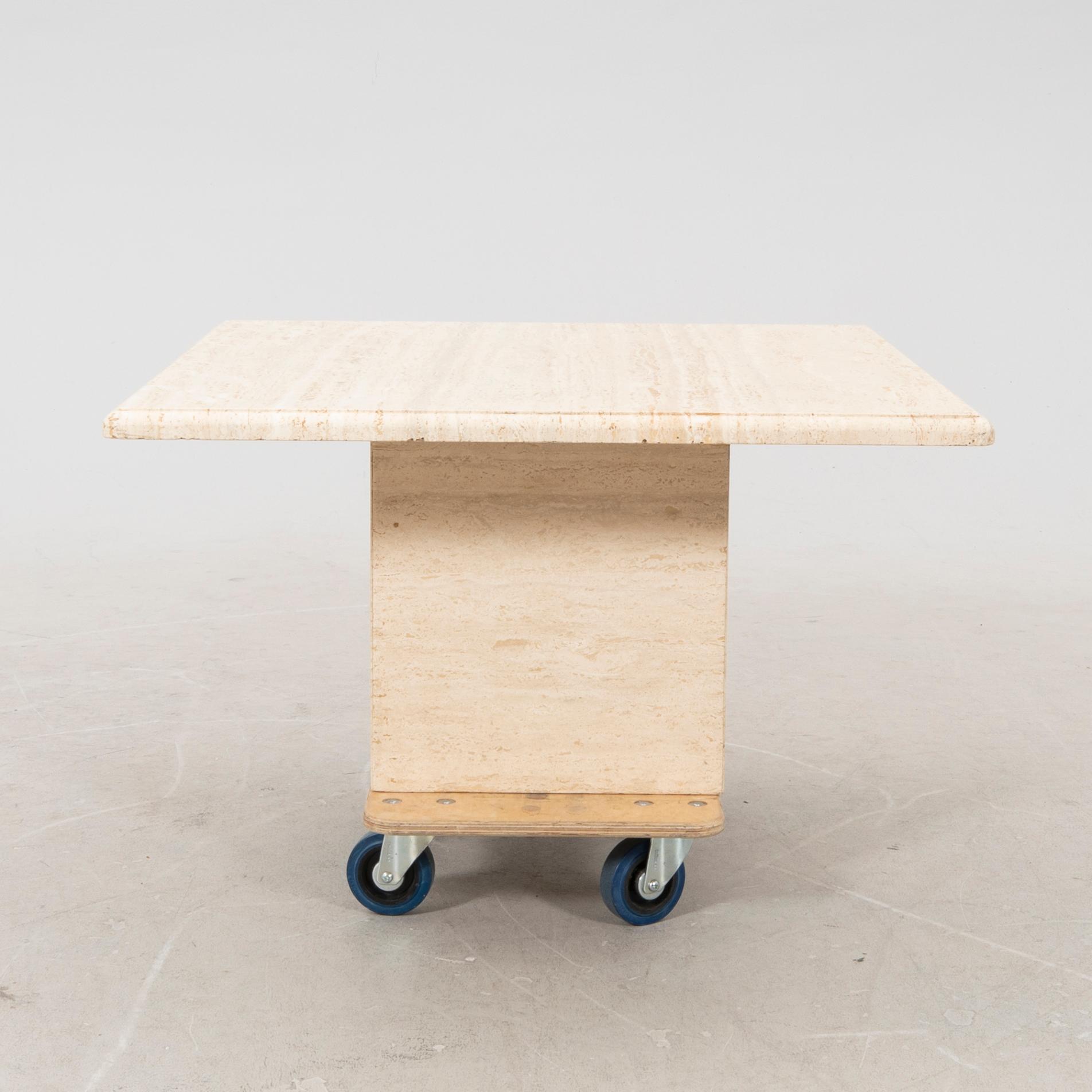 A late 20th century travertin coffee table.