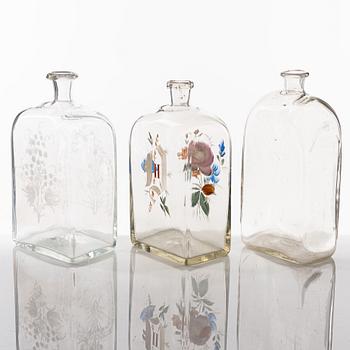A set of seven glass bottles, 19th Century/circa 1900.